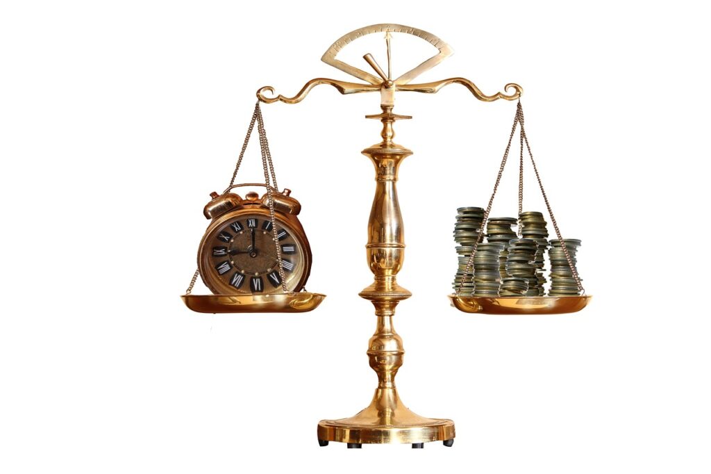 A scale with a clock on one side and a pile of coins on the other.