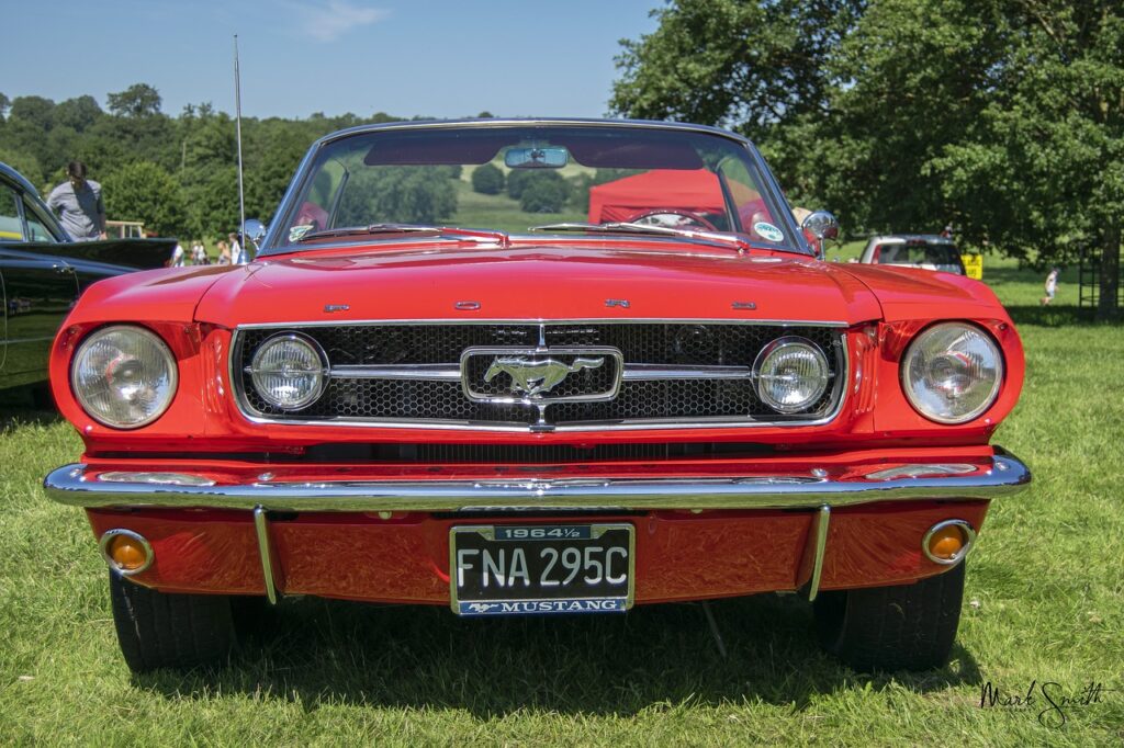 A red vintage Ford Mustang automobile.