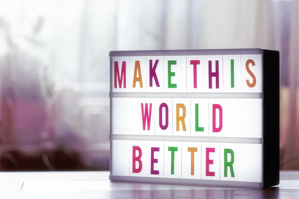 A sign that says "Make this world better".