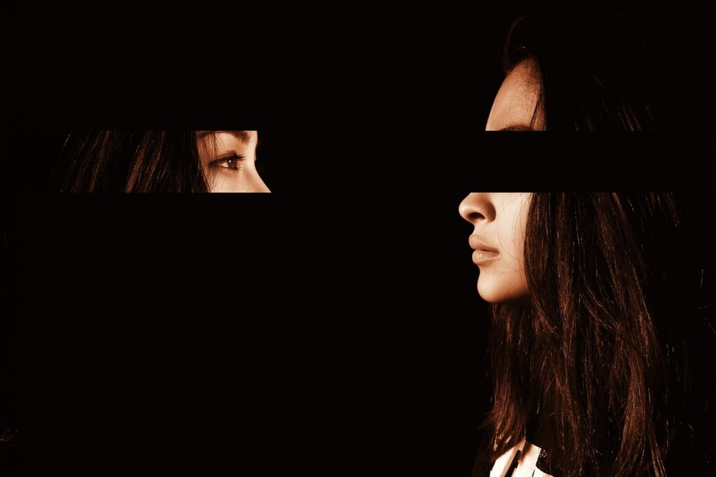A picture of a girl appearing to have her eyes turned back looking at her face.  Appears to be an AI image on a black background.