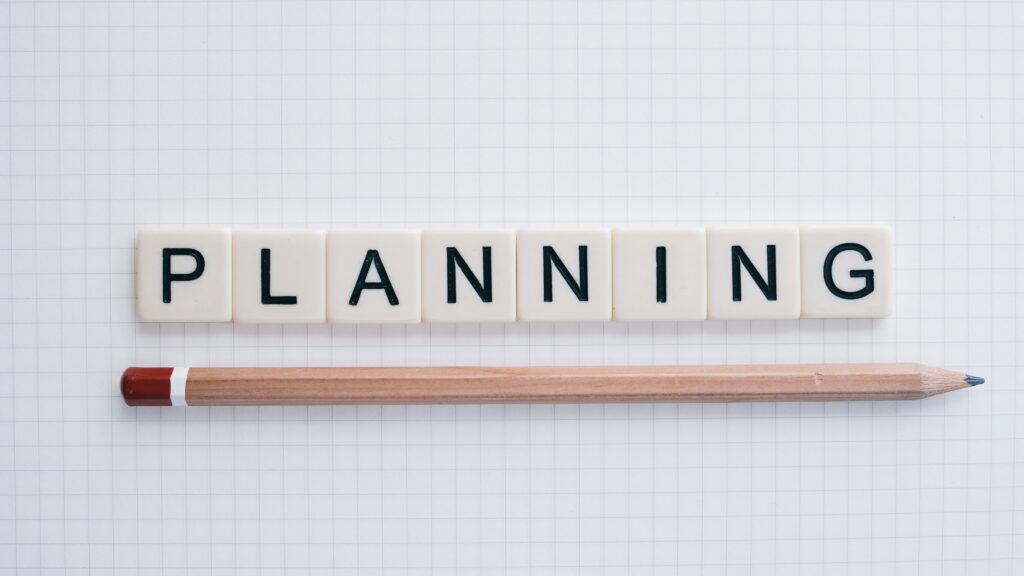 The word Planning with a pencil under it.