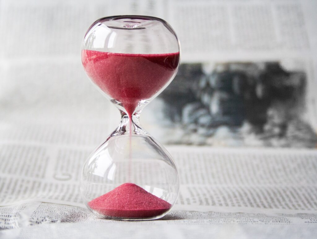 An hourglass on a table.
