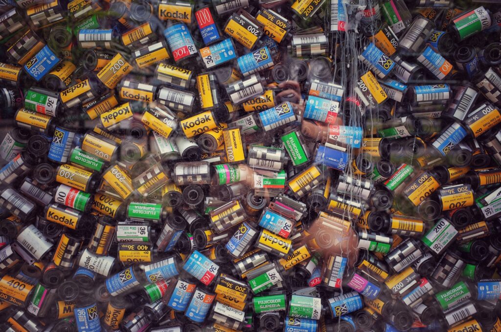 A pile of Kodak film rolls.